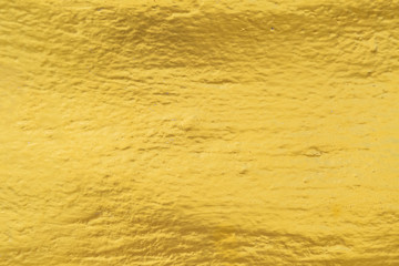 Gold paint on cement wall texture
