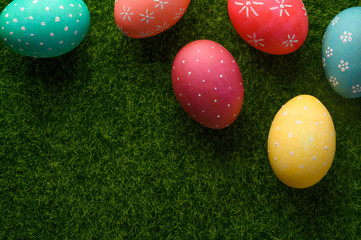 Easter eggs on grass flat lay, easter composition. With space