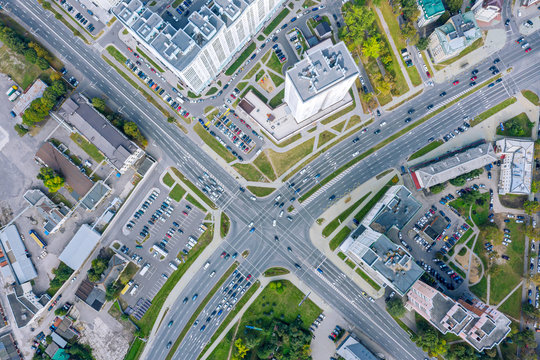 aerial top view of urban road intersection on a summer day. car traffic on city crossroad