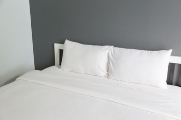 Fototapeta na wymiar Two white pillow on bed and blanket