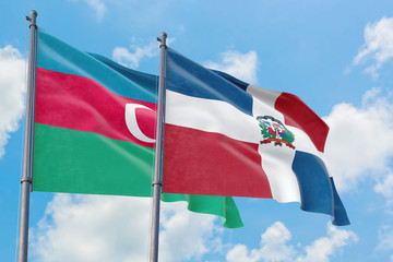 Dominican Republic and Azerbaijan flags waving in the wind against white cloudy blue sky together. Diplomacy concept, international relations.