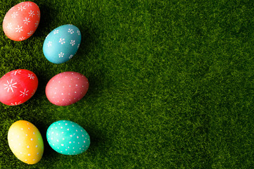 Easter eggs on grass flat lay, easter composition. With space