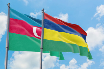 Mauritius and Azerbaijan flags waving in the wind against white cloudy blue sky together. Diplomacy concept, international relations.