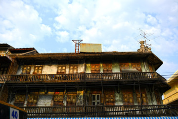 Fototapeta na wymiar Ancient wooden houses in China Town(Yaowarat), Bangkok, Thailand