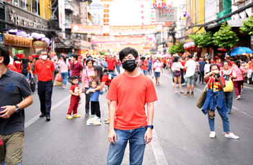 The young man wearing a red dress went to visit a traditional Chinese New Year at Chinatown (Yaowarat) 2020, Bangkok, Thailand January ‎25, ‎2020, ‏‎5:27:40 PM