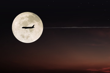 Dramatic atmosphere and lovely romantic beautiful super moon night sky clouds and stars with...