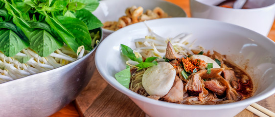 Meatball noodle with blood soup, street food in Thailand, travel choice, panoramic view