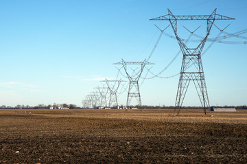 electricity pylons in a field