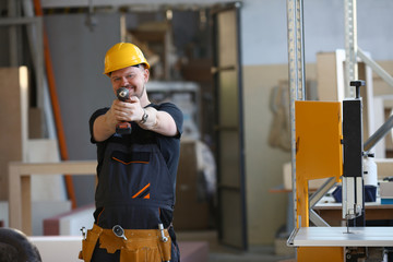 Arms of worker using electric drill closeup. Manual job DIY inspiration improvement fix shop yellow helmet joinery startup idea industrial education, profession career concept