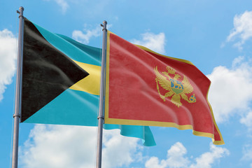 Montenegro and Bahamas flags waving in the wind against white cloudy blue sky together. Diplomacy concept, international relations.