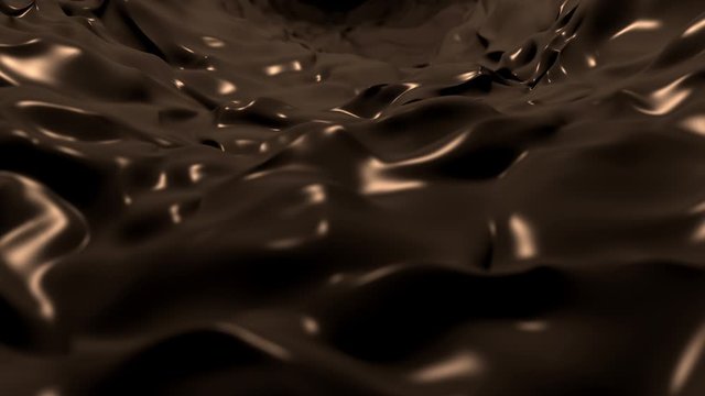 Flowing stream of dark, silky melted chocolate motion background.