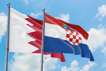 Croatia and Bahrain flags waving in the wind against white cloudy blue sky together. Diplomacy concept, international relations.