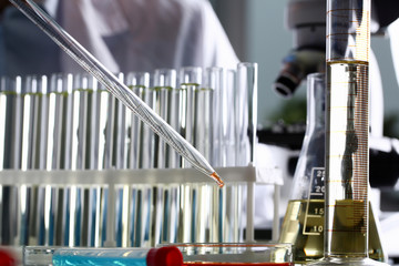 Yellow liquid spilled petrol additive innovative supply. Conveyor line production household...