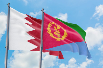 Fototapeta na wymiar Eritrea and Bahrain flags waving in the wind against white cloudy blue sky together. Diplomacy concept, international relations.