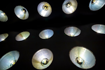 Many luminous spotlights are built into the wall.