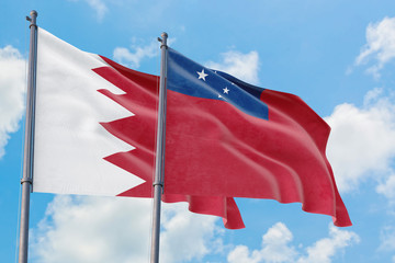 Samoa and Bahrain flags waving in the wind against white cloudy blue sky together. Diplomacy concept, international relations.