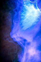 Blurry blue swirling lights at night