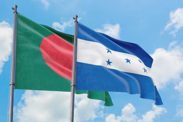Honduras and Bangladesh flags waving in the wind against white cloudy blue sky together. Diplomacy concept, international relations.