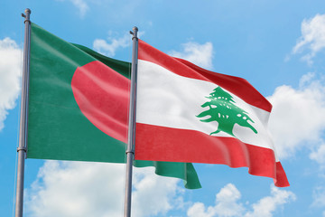 Lebanon and Bangladesh flags waving in the wind against white cloudy blue sky together. Diplomacy concept, international relations.