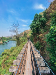 Fototapeta premium Railway tracks near the river nature transportation backgrounds