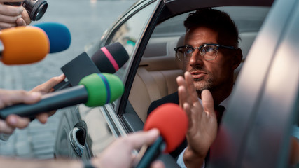 Stories that count, from people who care. Reporters trying to interview important person....