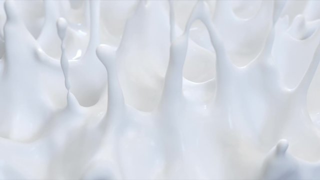 splash of milk. white liquid or paint. slow motion