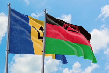 Malawi and Barbados flags waving in the wind against white cloudy blue sky together. Diplomacy concept, international relations.
