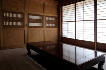 Traditional living room of Japan with washi paper door and wood carving frame.