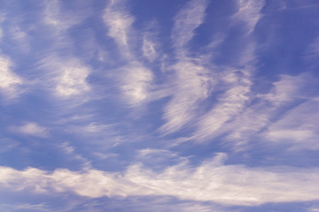 evening blue sky with high cirrus clouds to change weather