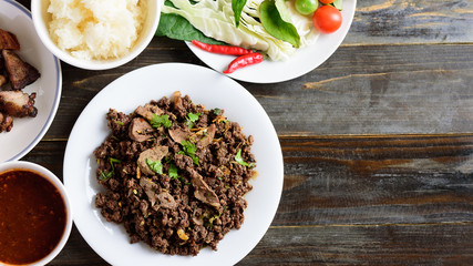 Northern Thai food, spicy minced pork salad (Larb Moo Kua) eating with sticky rice, grilled...