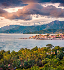Dramatic spring view of Saint-Florent port, Haute-Corse department of France, Europe. Gorgeous sunset on Corsica island. Colorful seascape of Mediterranean sea. Traveling concept background...