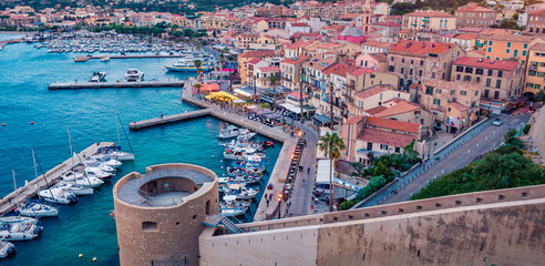 Panoramic evening cityscape of Calvi port. Superb summer scene of Corsica island, France, Europe....