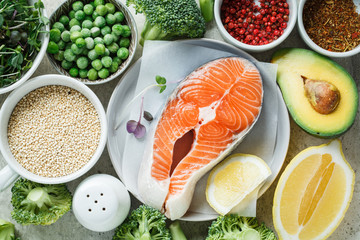  Raw salmon steak and ingredients, top view. Balanced food background.