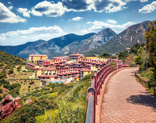Splendid spring cityscape of Nebida town. Sunny morning view of Sardinia island, Italy, Europe. Traveling concept background..