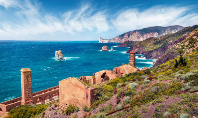 Splendid spring view of ancient ruins of Laveria Lamarmora (Miniera di Nebida). Attractive morning scene of Sardinia, Italy, Europe. Nice Mediterranean seascape. Traveling concept background..