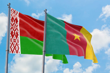 Cameroon and Belarus flags waving in the wind against white cloudy blue sky together. Diplomacy concept, international relations.