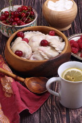 Homemade dumplings with cherries and raspberries