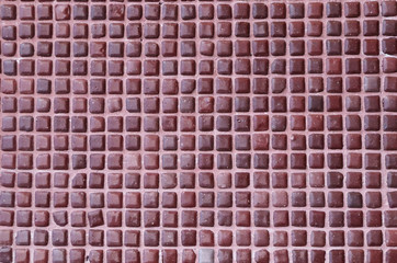 Wall with square tiles of brown color