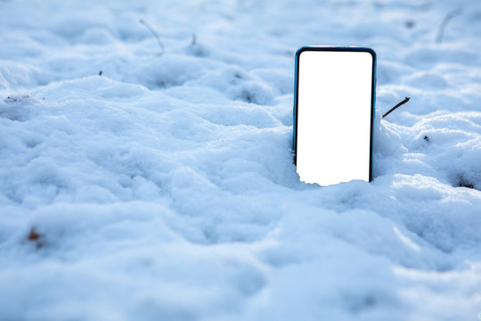 phone in snow white empty screen copy space