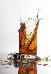 Glasses of scottish whiskey with ice cubes