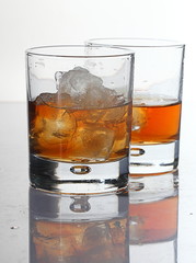 Glasses of scottish whiskey with ice cubes