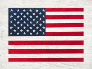 American Flag lying on the table. Place for your inscriptions. Top view, close-up. National holiday concept