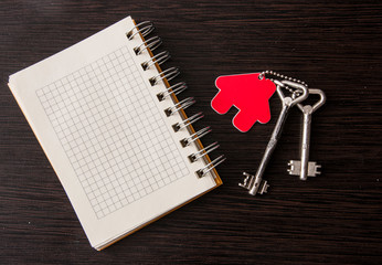 Blank notebook on wooden background.