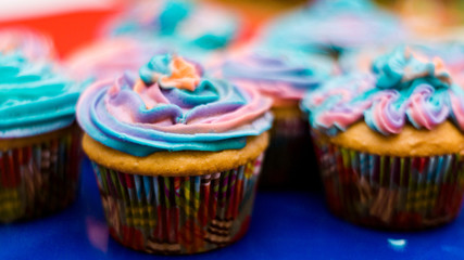 Fototapeta na wymiar Fanta cupcakes with frosting and sprinkles