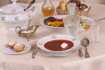 Still-life with borsch with vodka on a festive table