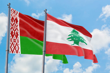 Lebanon and Belarus flags waving in the wind against white cloudy blue sky together. Diplomacy concept, international relations.
