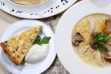 Mushroom soup on white wooden table