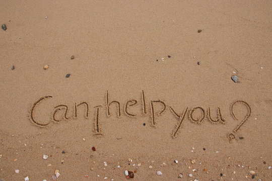 inscription on the sand, Handwriting  words "Can I help you?" on sand of beach.