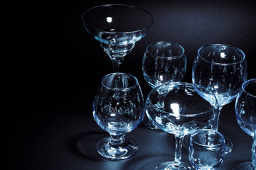 Empty  glasses for drinks on dark background