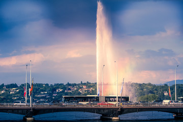 Naklejka na ściany i meble The Geneva water fountain with rainbow near the mont blanc bridge, Geneva Switzerland